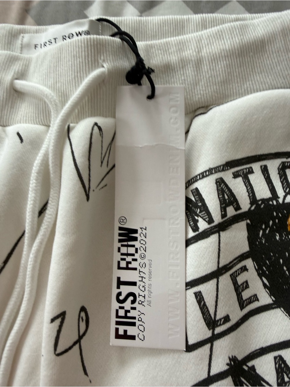 First Row White Graphic Drawstring Sweatpants with Multi-Color Designs - Picture 3 of 5